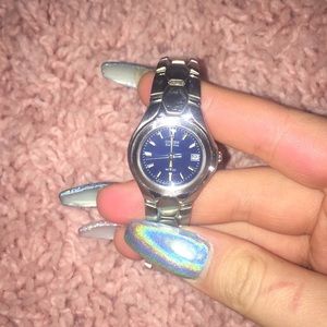 Citizen eco-drive stainless steel woman’s watch.